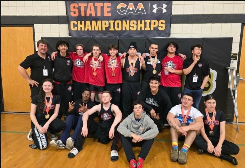 The Imagine Prep Surprise wrestling team poses for a photo Feb. 4 in Apache Junction after a successful Canyon Athletic Association wrestling championship meet.