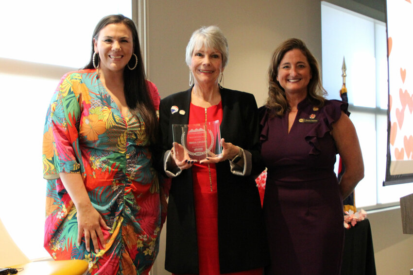 Tricia Lehane, center, was awarded the 2023 Realtor of the Year by Affiliate of the Year Rachel Tarman and past Realtor of the Year Shauna Huisman.
