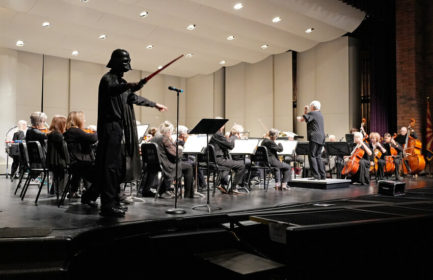 Darth Vader suddenly appeared as conductor Julie Mahoney led the East Valley Pops Orchestra in the &quot;Star Wars&quot; theme at a March 1 concert at Gilbert High School.  Instrumental music students from eight Gilbert elementary schools attended the concert.