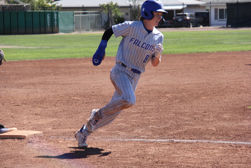 Junior Sam Barnard rounds third on his way home. He scored four runs in the Falcons&rsquo; 26-0 win over Mayer. (Submitted photo/Jane Irwin)