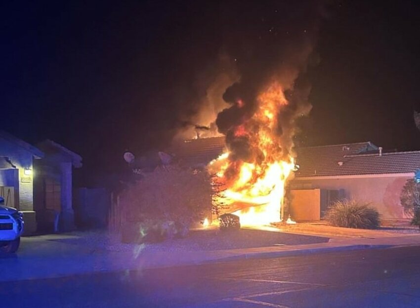 Firefighters from the Surprise Fire and Medical Department and El Mirage Fire Department fought a house fire in Surprise Tuesday evening that involved a hybrid vehicle in a garage.