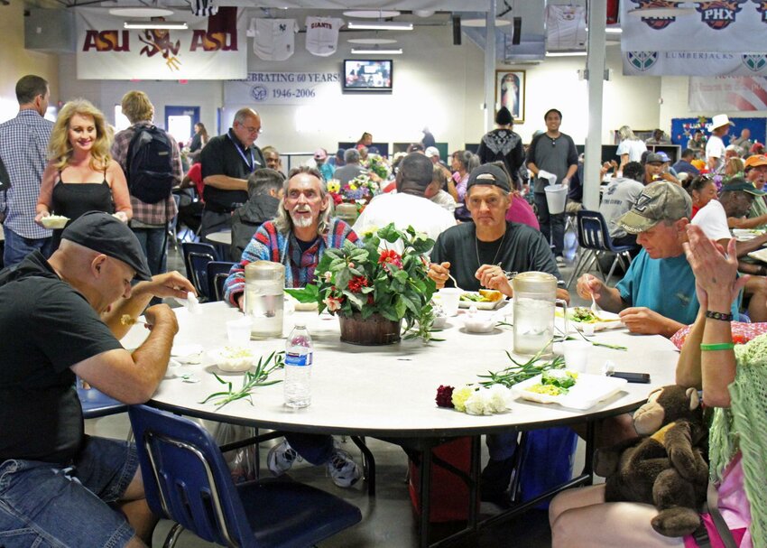 Diners enjoy a free meal at a past St. Vincent de Paul Easter Day Meal Service event. (Courtesy St. Vincent de Paul)