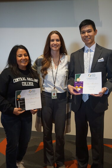 Central Arizona College's Black History cultural expression speaking competition first place winner Anna Maria Dennis, left, stands next to Professor Sandy Rath, center, and second place winner Niko Martinez, right.