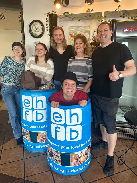 Steve Baggio of Fountain Hills orchestrated a food drive for Fountain Hills which brought together four local businesses in support of the Extended Hands Food Bank including Sipps Eatery. Pictured is Sipps Eatery and Extended Hands Food Bank staff along with Steve Baggio (in the barrel).