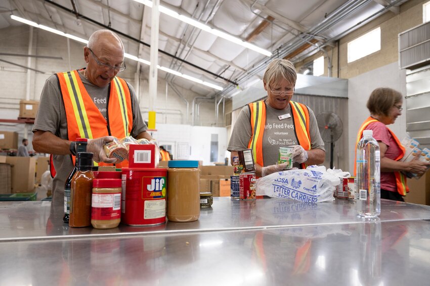 Volunteers work at St. Mary's Food Bank. St. Mary&rsquo;s Food Bank in Surprise needs volunteers to make sandwiches for children.