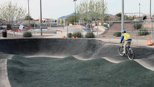 Adam Robinson, deputy director of Queen Creek&rsquo;s Community Services department, takes a ride on Mansel Carter Oasis Park&rsquo;s new pump track. The track opens on Saturday, March 9.