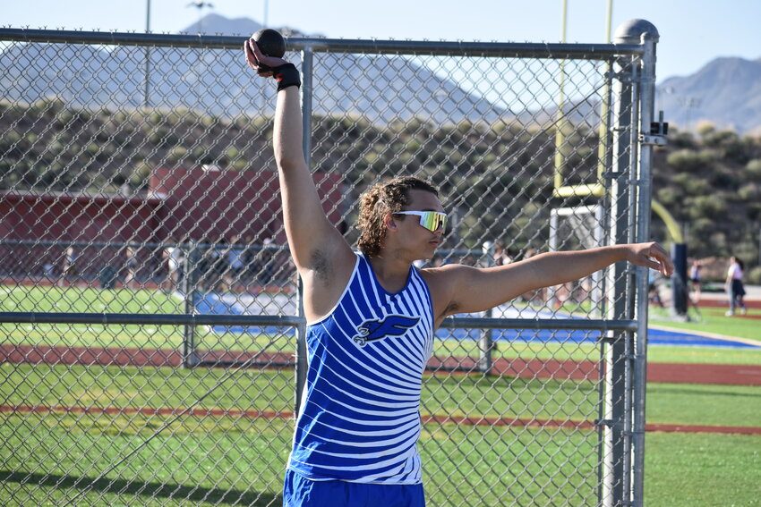 Senior Keian Evans warms up before recording the second-best shot put throw in Fountain Hills school history. (Independent Newsmedia/George Zeliff)