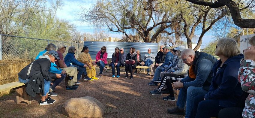 Participants on the Fort McDowell Yavapai Tour take a load off outisde the Fort McDowell Museum &amp; Culture Center.