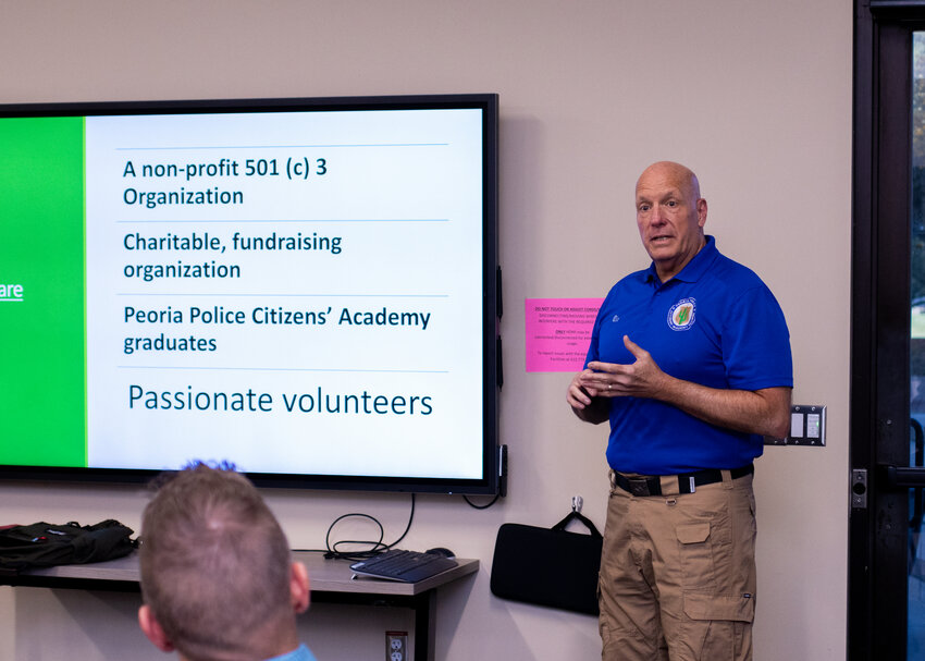 Ric Harrison, director of Peoria Police Citizens Academy Alumni Association, speaks at a recent chamber of commerce meeting.
