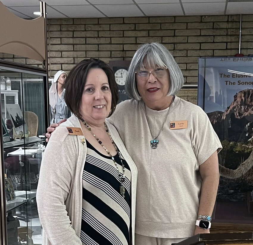 Barb Kelly, left, stands with Pinal County Historical Museum's president, Cathy Adam, right. Kelly has been awarded the 2024 President's Award by the museum.
