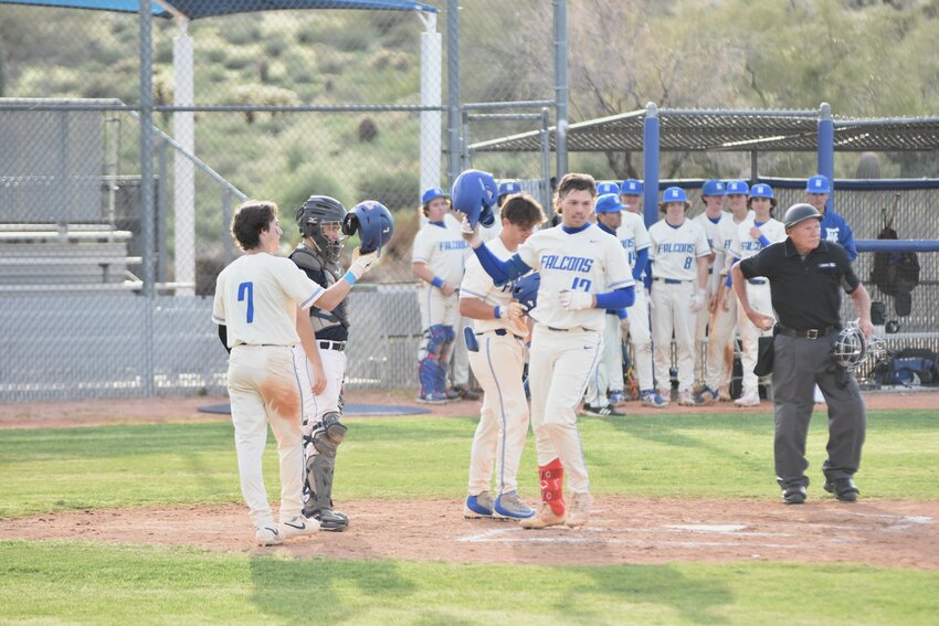 Senior Tyler Langer (#17) celebrates a home run with his teammates. (Independent Newsmedia/George Zeliff)