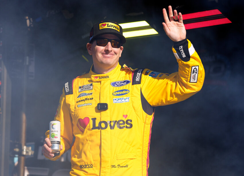 Michael McDowell waves to fans during driver introductions for the Daytona 500 on Feb. 19, 2024, in Daytona Beach, Florida.