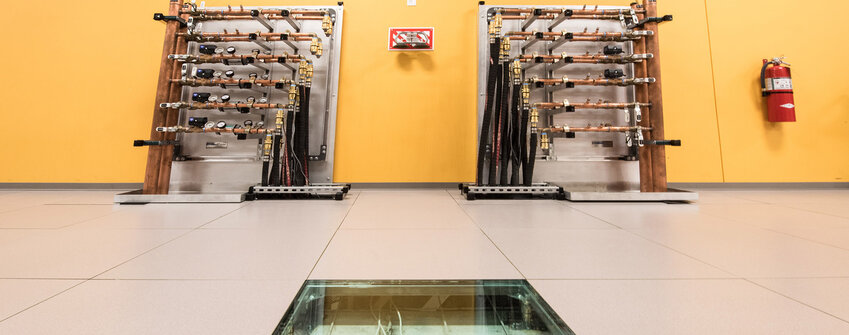 February 09, 2017 - Hot Aisle Containment (HAC) manifolds providing energy recovery water (ERW) supply and return ports for water cooled computers in the ESIF Data Center. (Photo by Dennis Schroeder / NREL)