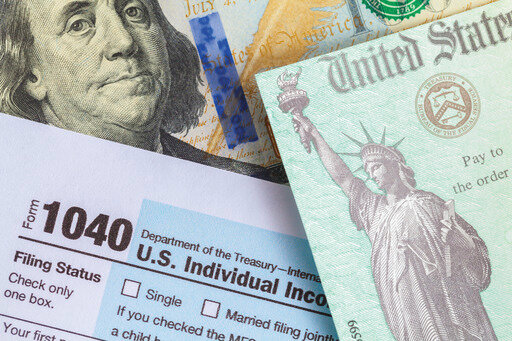 In a new court filing, federal attorneys say that tax rebate  payments of up to $750 for about 750,000 Arizona families qualify as &quot;income'' under federal law.