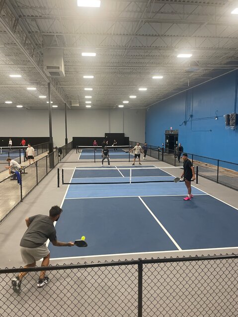Pickleball players compete earlier this year at The Pickleball Space in Glendale.