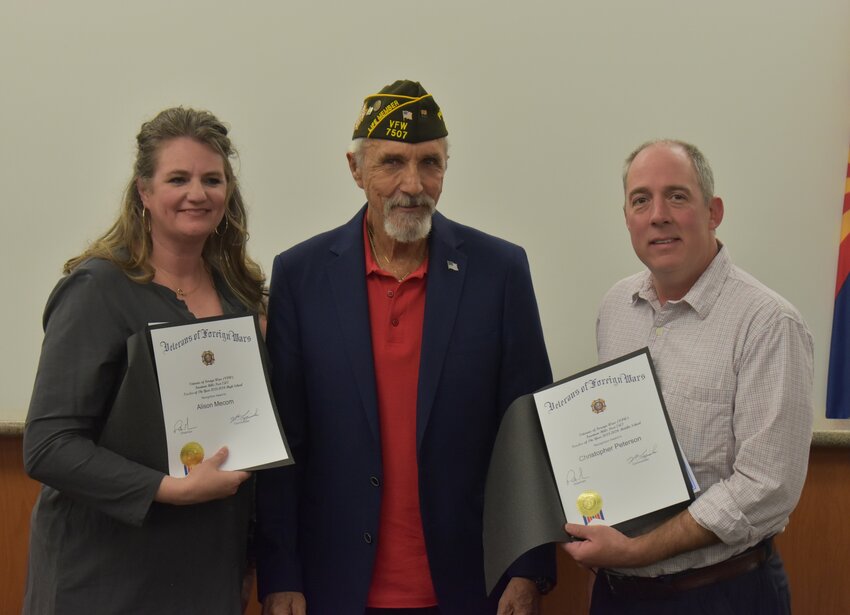 VFW Post Commander Bill Luzinski presents Teacher of the Year awards to Alison Mecom and Chris Peterson. (Independent Newsmedia/George Zeliff)