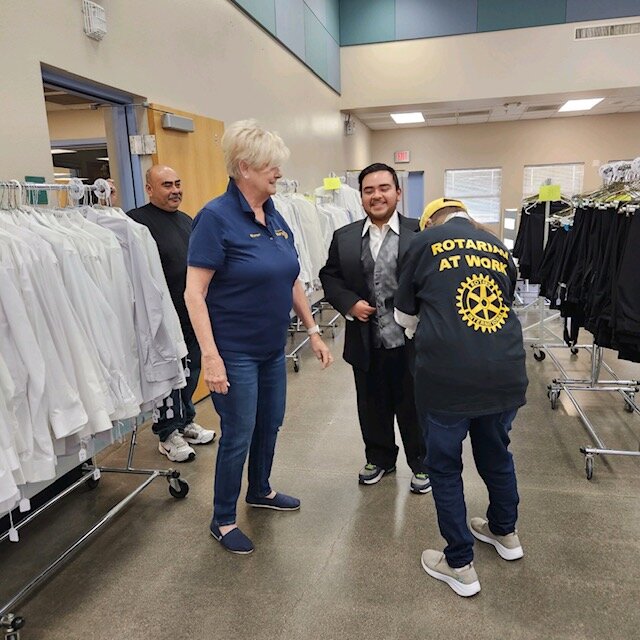 Members of the Peoria North Rotary Club assist a student as he gets fitted for formal wear at last year's Prom Closet. The Rotary-sponsored event will take place this year April 6-7 and 13-14.