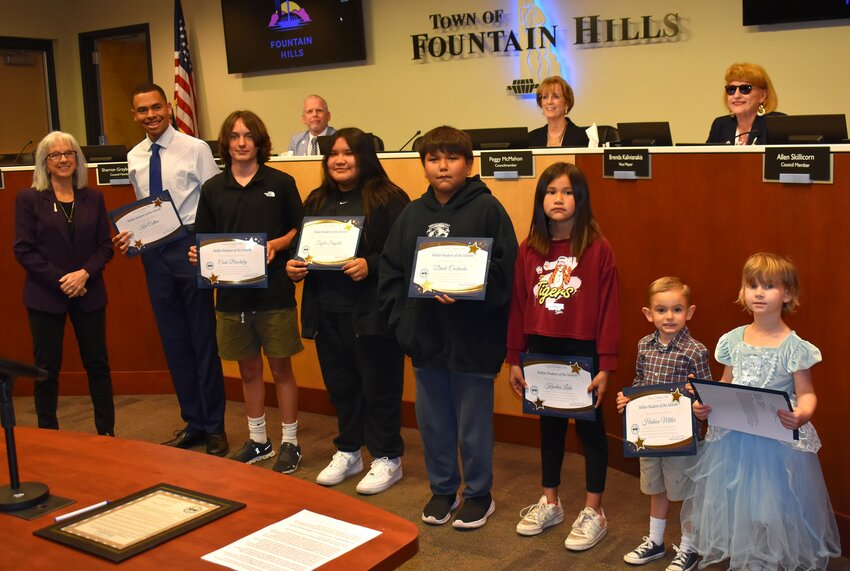 Fountain Hills Town Council recognized the School District&rsquo;s Stellar Students for the month of March at its March 19 meeting. From right from Little Falcons Preschool are Sabrina Rogers and Hudson Miller; McDowell Mountain Elementary School,  Kandus Lao and Dante Cachucha; Fountain Hills Middle School, Tayler Sinyella and Cash Broetsky; Fountain Hills High School, Kai Collier, and Mayor Ginny Dickey. Racine Homyak from Fountain Hills High School is absent from the photo.