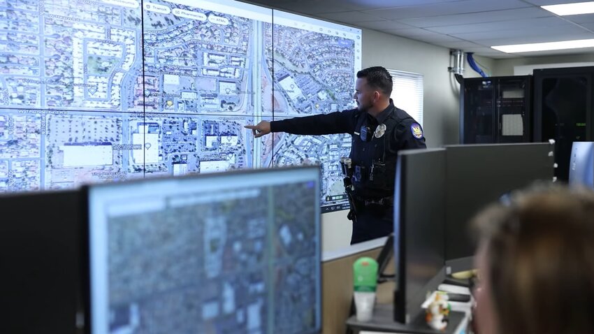 A Phoenix police officer points to a map on a screen at the Real Time Operations Center at the Cactus Park Precinct, which opened Thursday afternoon. (Courtesy city of Phoenix)