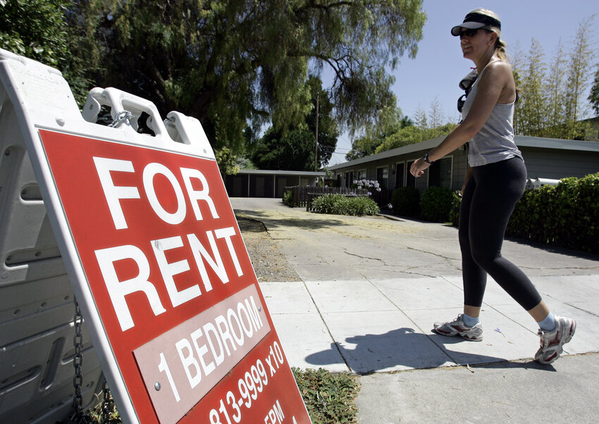 A woman walks next to a &quot;For Rent&quot; sign at an apartment complex in Palo Alto, Calif.   Some Valley renters in multifamily units have moved up in their quality of living thanks to recent perks from developers and a flood of new units expected during the next 18 months.