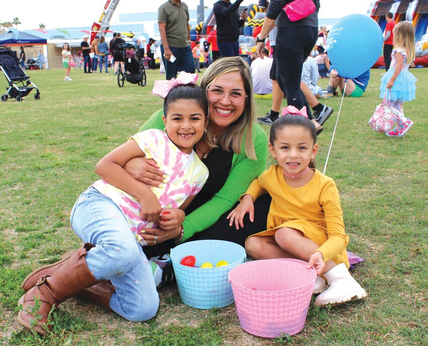 Gabi, Angela and Tata Russo joined hundreds of Fountain Hills residents and visitors in Four Peaks Park Saturday morning, March 23, for the annual Eggstravaganza. The event was put on by Fountain Hills Community Services, sponsored by The Goyena Team at MCO Realty and featured games, crafts and more hosted by local organizations. Thousands of eggs were collected in a matter of second during the big hunt. (Independent Newsmedia/Ryan Winslett)