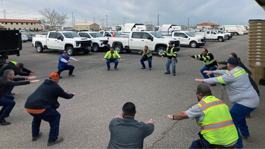 City of Goodyear Streets Division workers stretch at the beginning of their shift to warm up their muscles and reduce on-the-job injuries.