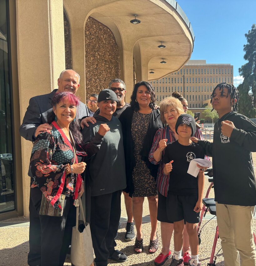 Phoenix native hall of fame boxer Michael Carbajal, in backwards black cap, poses with Phoenix City Councilmember Laura Pastor, center, and other supporters after Phoenix City Council unanimously renamed a street in Carbajal&rsquo;s honor last week. (Courtesy Laura Pastor)