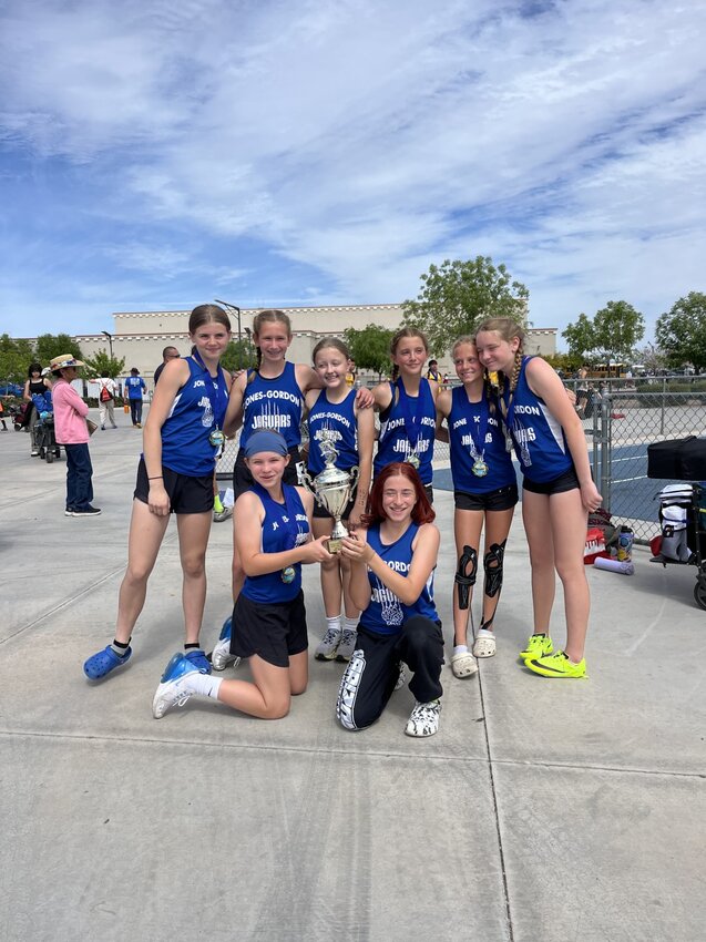 The Jones-Gordon School Girls Track team holds their first place trophy, March 24, 2024.