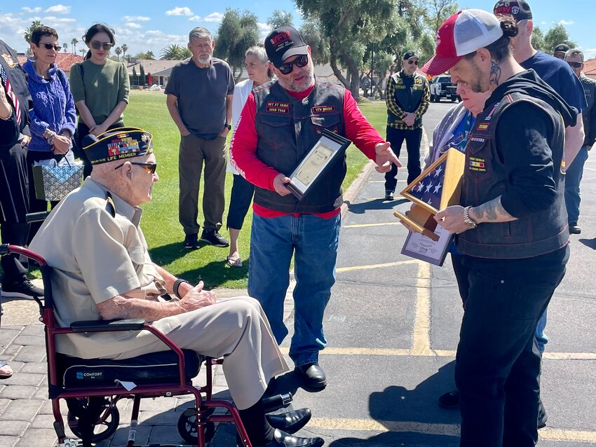 Sun City West resident Alfred Sokolowski receives various mementos from the VFW Post 285 riders.