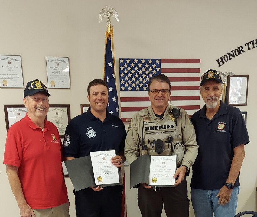 The VFW Post 7507 in Fountain Hills gave certificates of appreciation and cash awards to two Fountain Hills first responders. Pictured from left is the Immediate Past Commander Don Hervey, Fountain Hills Fire Department Training Captain John Krajnak, MCSO Deputy Gerald Flemming and Post Commander Bill Luzinski.