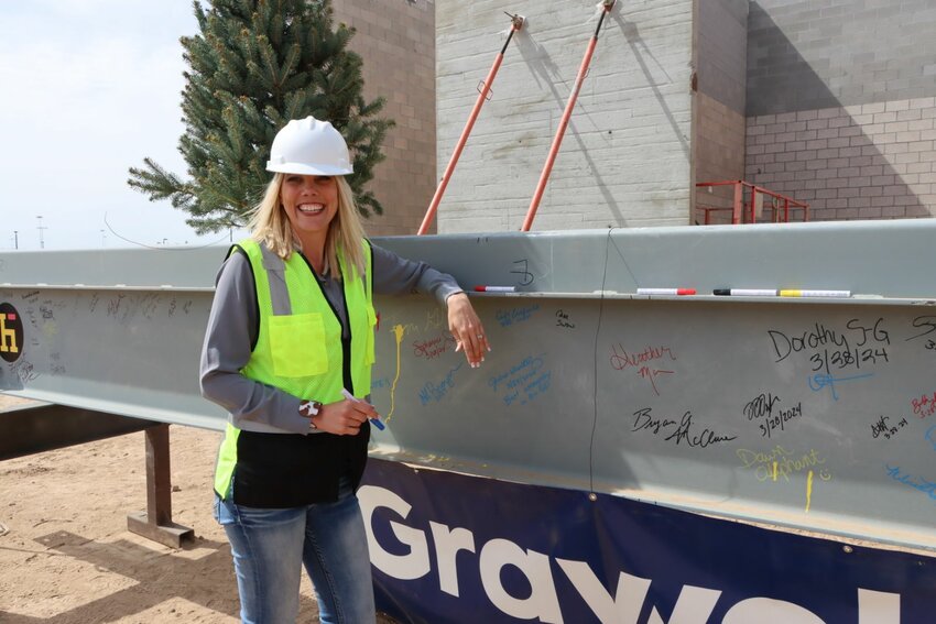 Queen Creek Mayor Julia Wheatley was on hand to sign the topping off beam at the aquatic and recreation center at Frontier Family Park