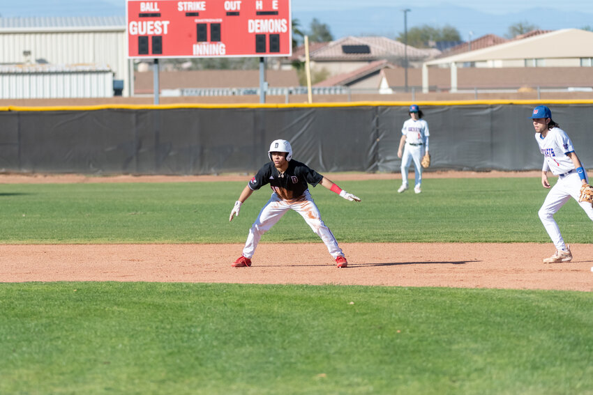 Dysart senior Jacob Moreno gets a big lead of second base in the Demons&rsquo; March 1 home win against Moon Valley. He leads the Demons with eight steals.