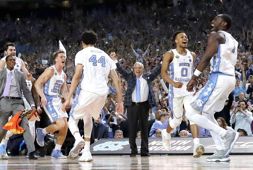 North Carolina coach Roy Williams and players celebrate after the Tar Heels beat Gonzaga in the NCAA college basketball title game April 3, 2017, at State Farm Stadium in Glendale. Valley cities are hoping the 2024 Final Four has at least as much positive economic impact as it did when it was last in the Valley in 2017.