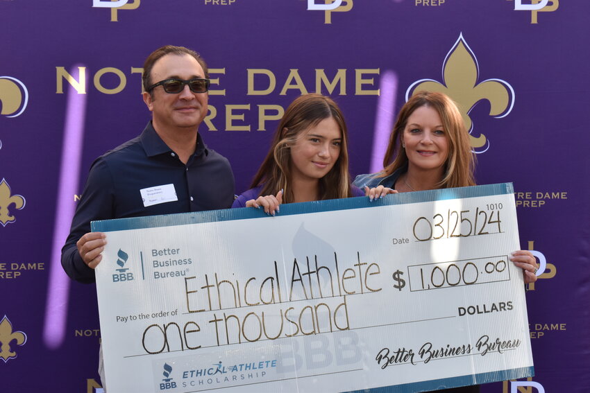 Skyler Ortega and her parents, Gil and Ashleigh Ortega, receive the Ethical Athlete Scholarship. (Independent Newsmedia/George Zeliff)