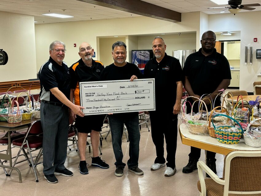 Ernie Kafcas and Bruce Halvorson, Sundial Men&rsquo;s Club executive board members, present Easter baskets and a check to Jesse Ramirez, founder, William Perez and Fredrick Williams, of the Valley View Community Food Bank.
