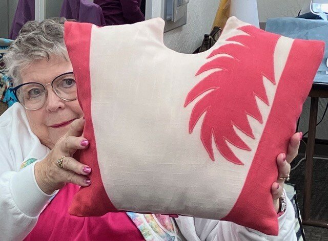 Ruth McCullough shows off the front of the bodice she transformed into a pillow.