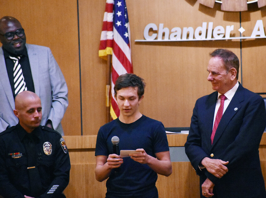 Chandler Mayor Kevin Hartke, right, and the City Council recently presented a plaque to Ethan Cakmak, a Chandler teen and a student at Hamilton High School, for his quick thinking and lifesaving efforts&nbsp; Feb. 7.