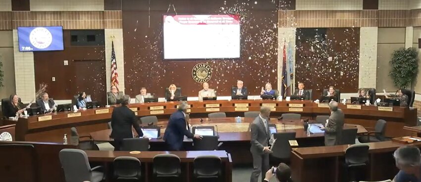 Peoria council celebrates the approvals of Caldwell BBQ and the Jefferson House by launching confetti into the city hall chamber April 2.