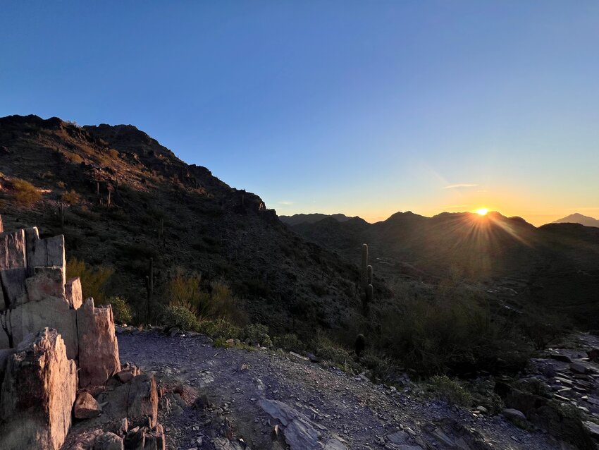 Sunrise seen from Camelback Mountain. Paradise Valley has cell network challenges due to various reasons including hillsides limiting coverage range.
