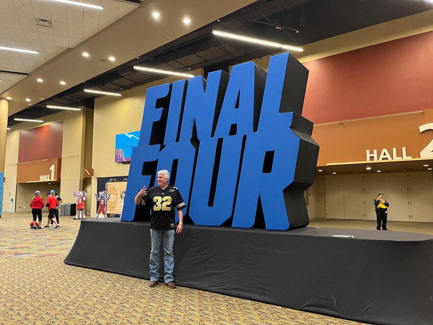 A Purdue fan poses with a sign at the Men&rsquo;s Final Four Fan Fest in downtown Phoenix.