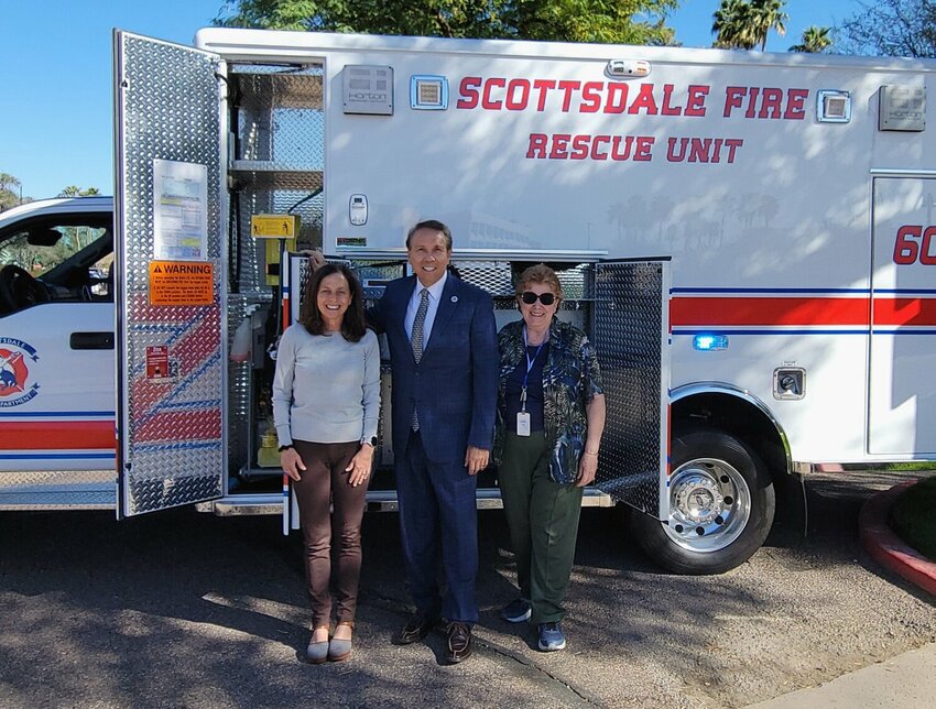 Scottsdale Vice Mayor Solange Whitehead, mayor David Ortega and council member Kathy Littlefield stand in front of a city owned ambulance. City officials hope to begin running a city-owned ambulance service next year.