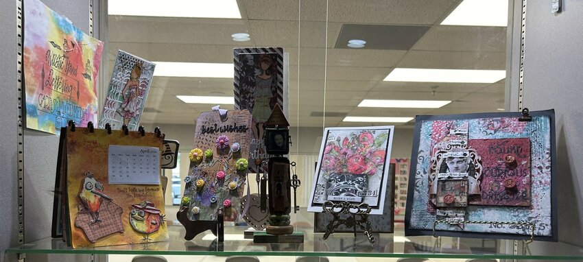 The work of Judy Ross, the Artistic Hand Lettering, Cards and Mixed Media Club&rsquo;s artist of the month, is displayed in the club&rsquo;s Kuentz Center window.