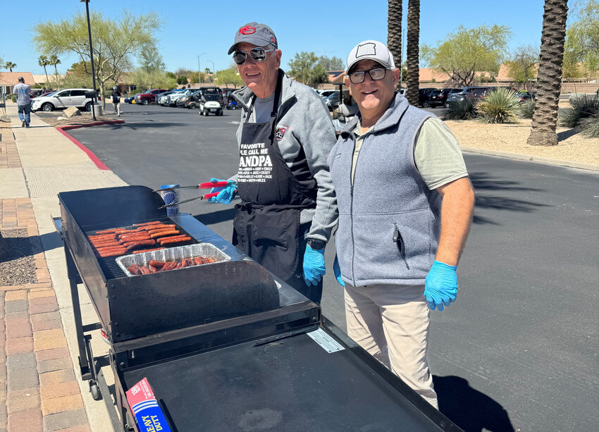 Golfers were greeted by Ralph Kwapiszeski and Adam Martini with free hotdogs at the Annual KC Charity Golf Tournament at Deer Valley GC Saturday April 6.