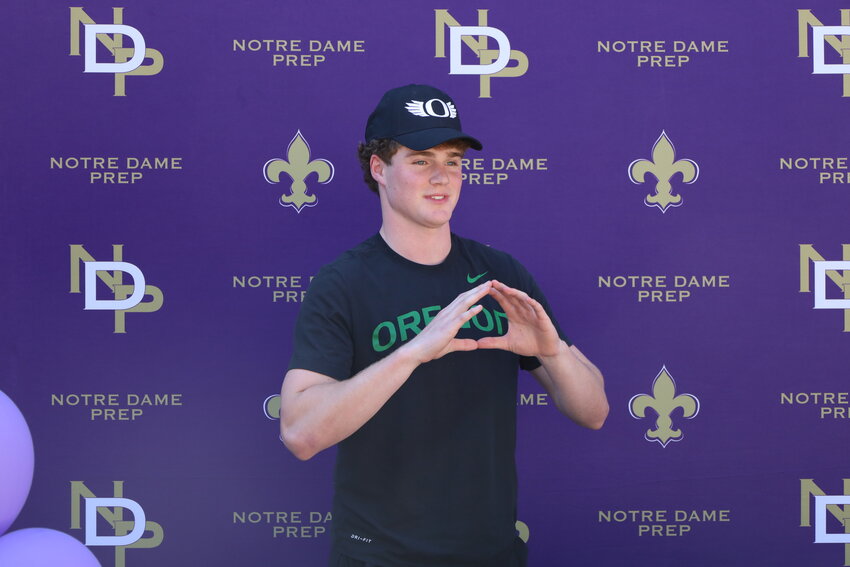 Notre Dame Prep junior Cooper Perry, makes his hands into a giant &ldquo;O&rdquo; after announcing his decision to attend the University of Oregon in the fall of 2025. (Submitted photo/Kimberly Haub)