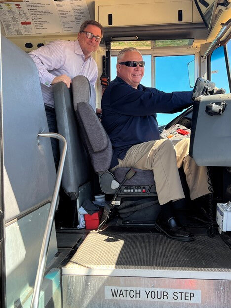 FUSD Governing Board President Roger Biede III, standing, and Florence Unified School Superintendent Chris Knutsen, sitting, recently visited the new FUSD-ADOT school bus test course in Florence.