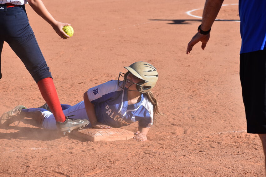 Senior Stella Grieco steals third base in her first game in two years. (Independent Newsmedia/George Zeliff)