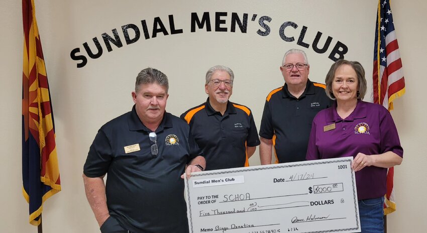 Sundial Men&rsquo;s Club donated $5,000 to the Sun City Home Owners Association April 17. Ed Van Ness, SCHOA president, left, and Lisa Gray, SCHOA general manager, right, accepted the donation from Ernie Kafcas and Jerry Hafner, Men&rsquo;s Club board member and president, respectively.