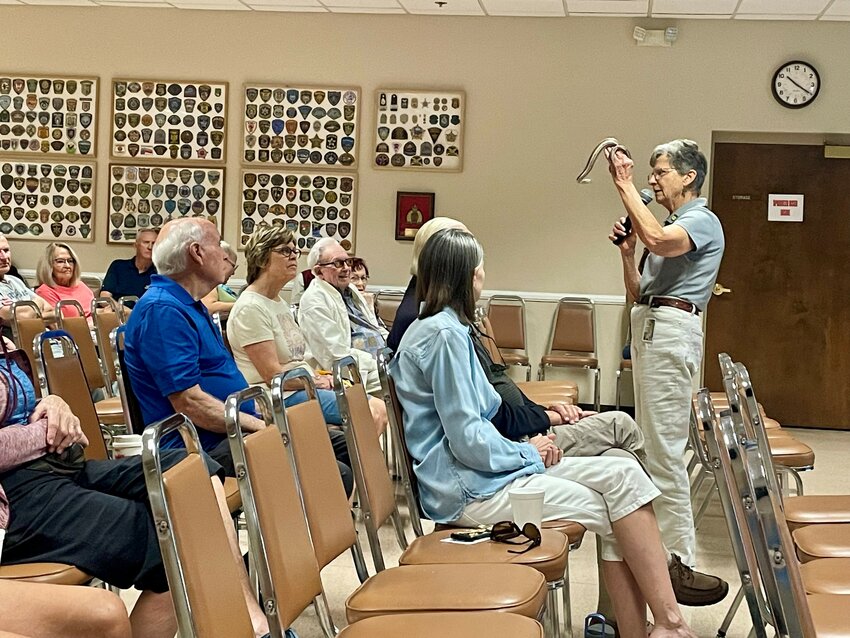 Betty Mulcahy, Arizona Game &amp; Fish Department volunteer, shows a snake to those in attendance during a recent Sun City West Posse Neighborhood Watch meeting.