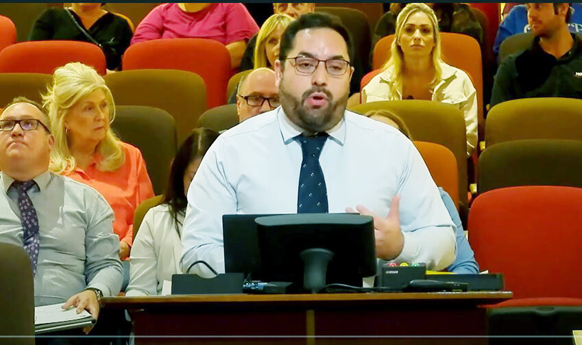 Chandler Planner Ben Cereceres speaks during the City Council’s April 18, three-hour meeting, where a QuikTrip rezoning and development plan was advanced by a 5-2 vote.