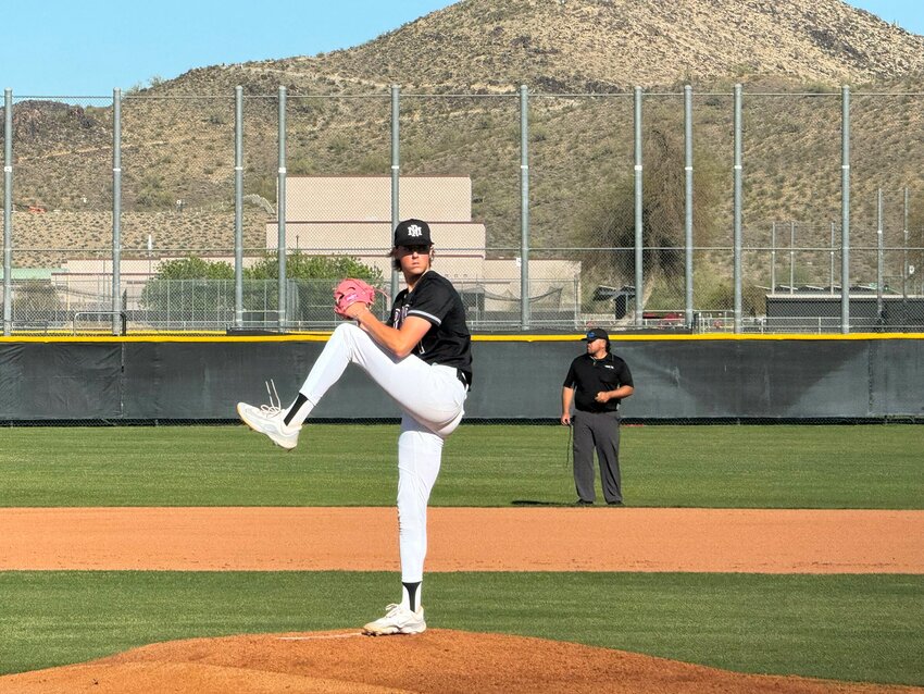 Mountain Ridge senior pitcher Smith Bailey winds up to deliver a pitch during the Mountain Lions&rsquo; April 2 home win against Boulder Creek. Bailey has signed to pitch for the University of Arizona.